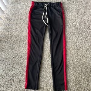 Black joggers with red stripes